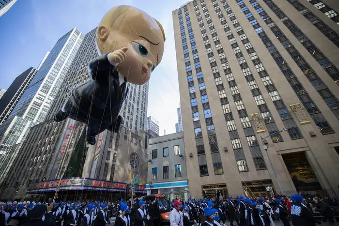 A balloon float of a large baby at the Macy's Thanksgiving Day Parade.